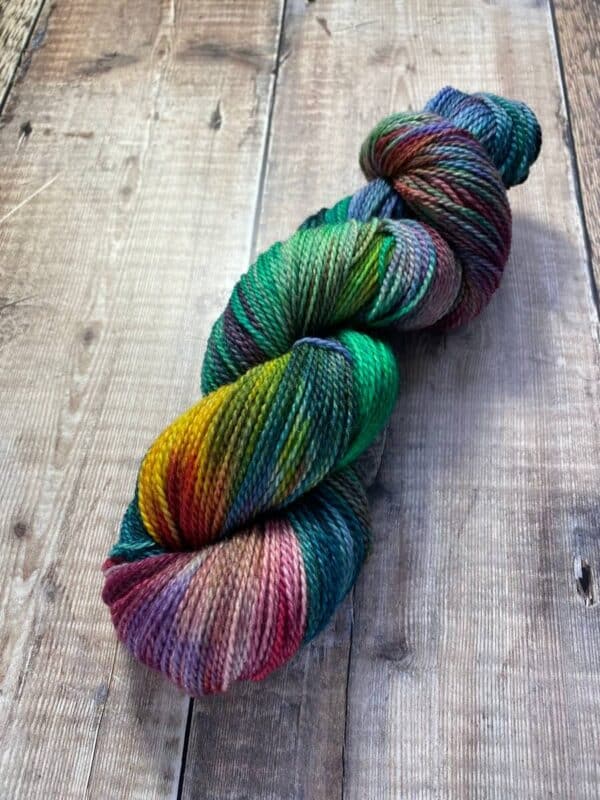 Sultry Rainbow sock yarn on wood table