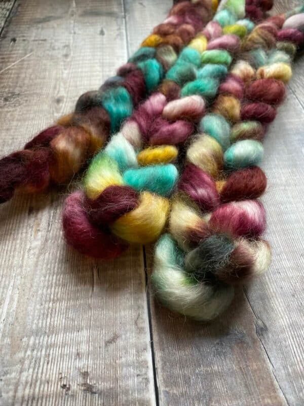 Close-up of 3 Wensleydale wool top hand dyed in jewel tones